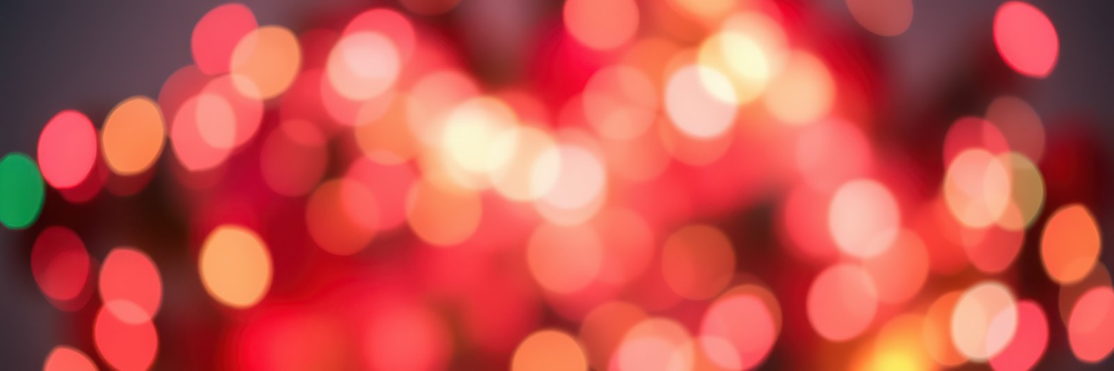 Vibrant bokeh lights create a festive atmosphere during evening celebrations in a cozy setting
